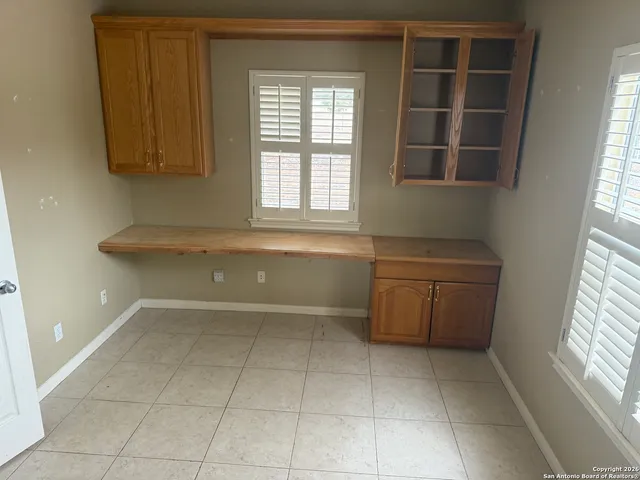 a bathroom with a granite countertop sink a toilet and a bathtub