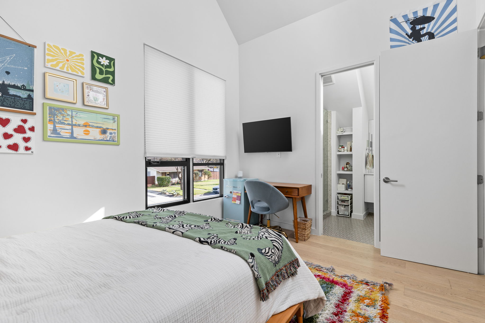 7502 St Louis Street Austin, TX 78757 - Photo 23 of 38 Bedroom featuring lofted ceiling and light wood finished floors