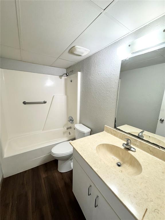 1229 Kennedy Road, Unit 69 Daytona Beach, FL 32117 - Photo 11 of 16 a bathroom with a double vanity sink toilet and a mirror