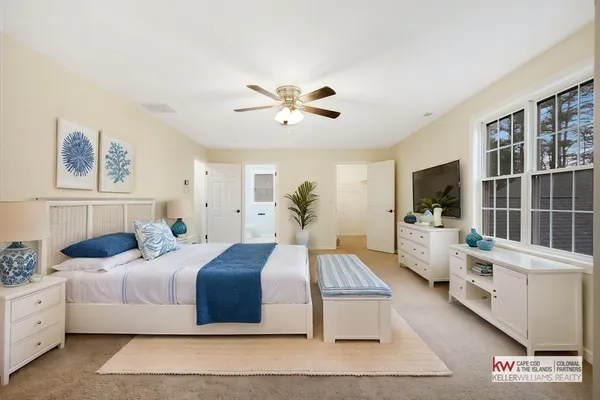 a bedroom with double bed and a flat screen tv
