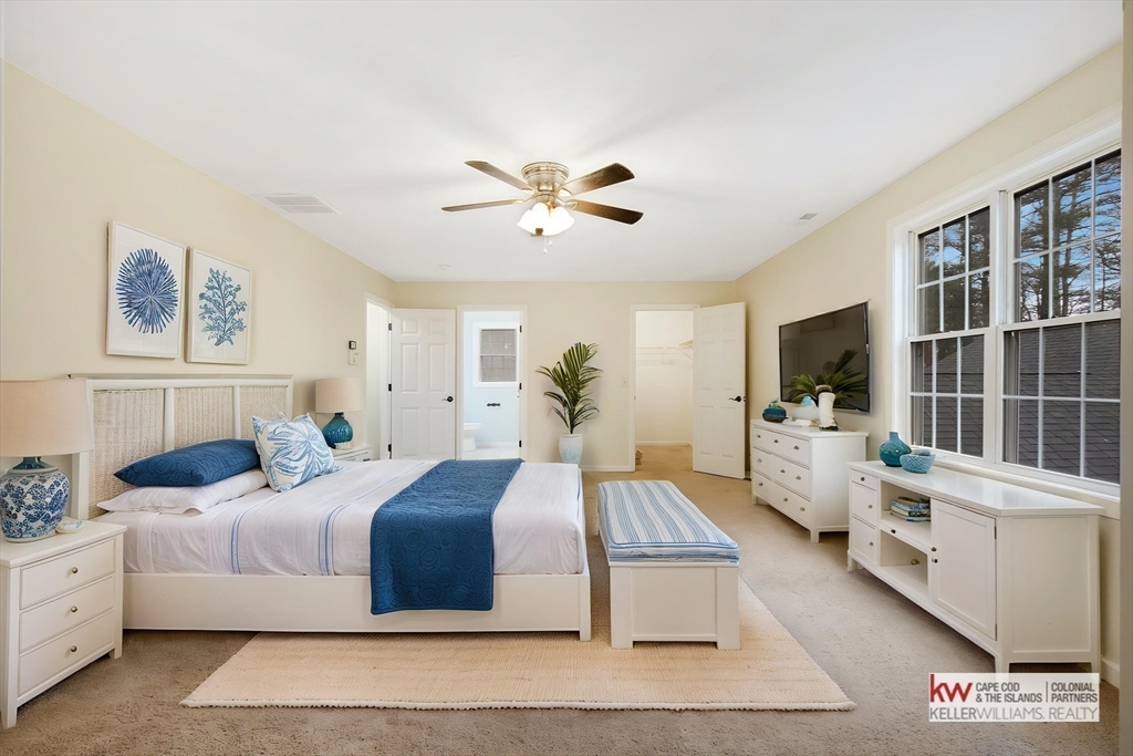 269 Tispaquin Street Middleboro, MA 02346 - Photo 14 of 40 a bedroom with double bed and a flat screen tv