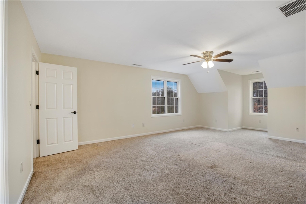 269 Tispaquin Street Middleboro, MA 02346 - Photo 15 of 40 a view of an empty room with chandelier fan