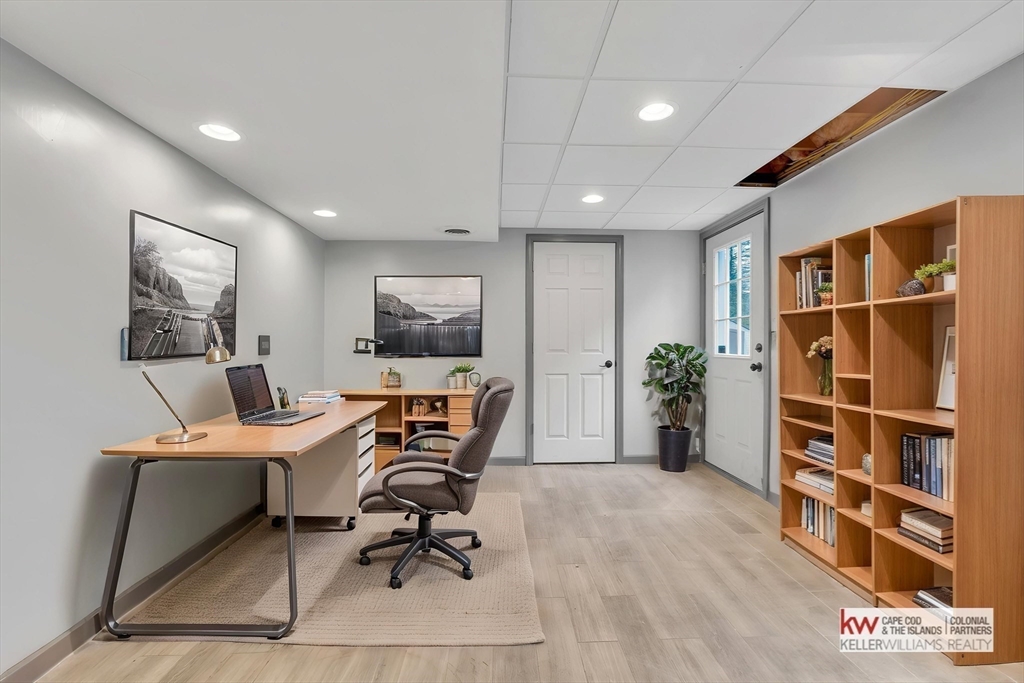 269 Tispaquin Street Middleboro, MA 02346 - Photo 23 of 40 a view of a workspace with furniture and a window