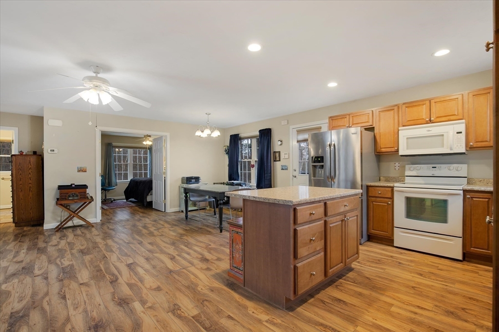 269 Tispaquin Street Middleboro, MA 02346 - Photo 25 of 40 a kitchen with stainless steel appliances granite countertop a stove and a refrigerator