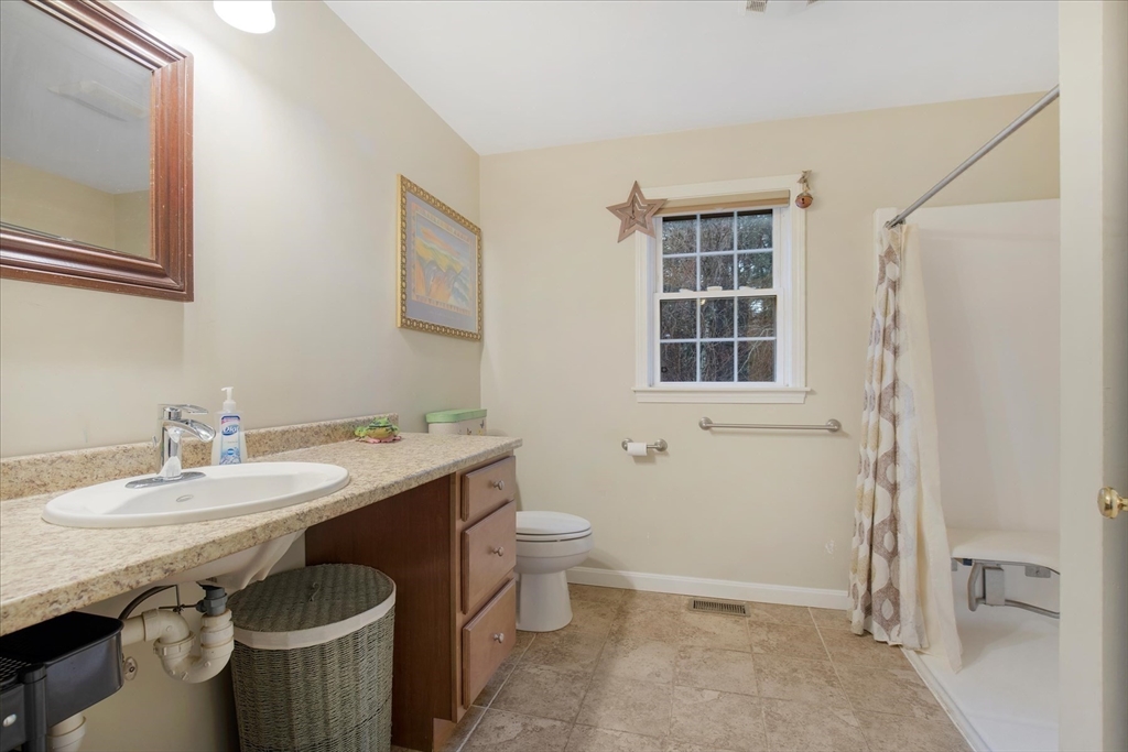 269 Tispaquin Street Middleboro, MA 02346 - Photo 33 of 40 a bathroom with a sink toilet and shower