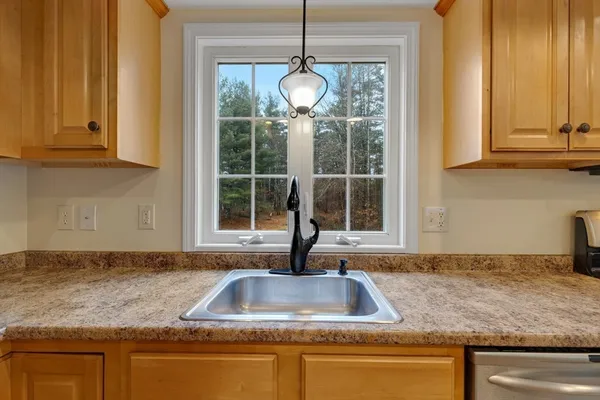 a kitchen with sink and window