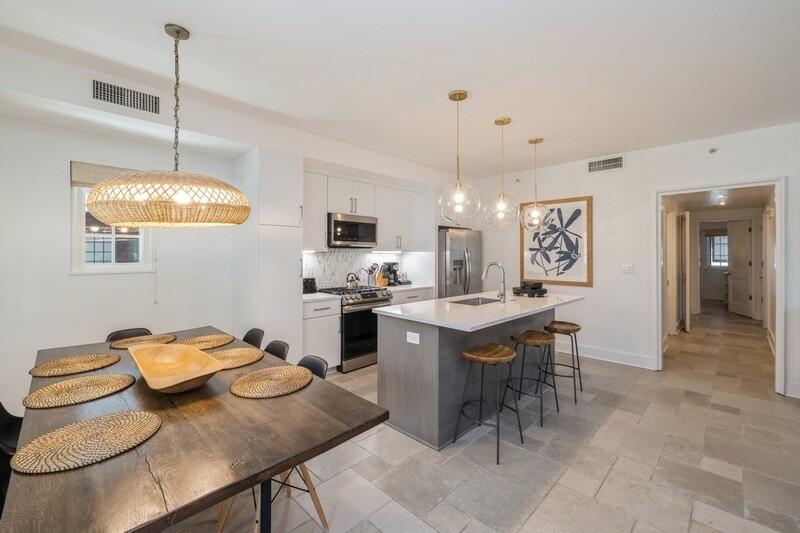 a kitchen with furniture a window and appliances