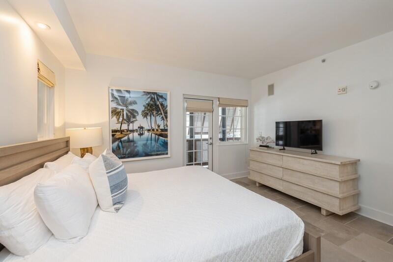 136 Georgetown Avenue, Unit 3B5 Rosemary Beach, FL 32461 - Photo 11 of 22 a bedroom with a bed and a flat screen tv