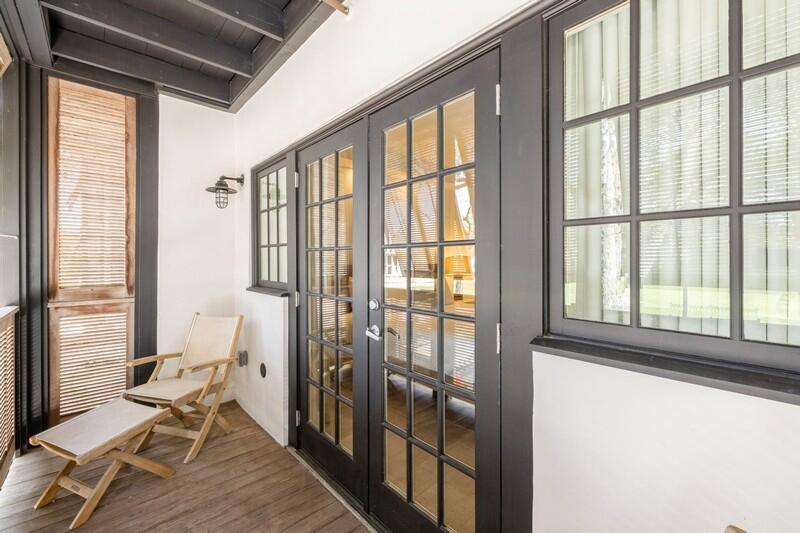 136 Georgetown Avenue, Unit 3B5 Rosemary Beach, FL 32461 - Photo 15 of 22 a living room with furniture and floor to ceiling windows