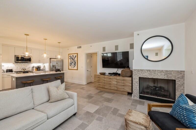 136 Georgetown Avenue, Unit 3B5 Rosemary Beach, FL 32461 - Photo 2 of 22 a living room with furniture a fireplace and a flat screen tv
