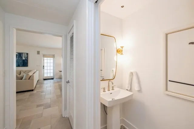 a en suite bathroom with a sink and mirror