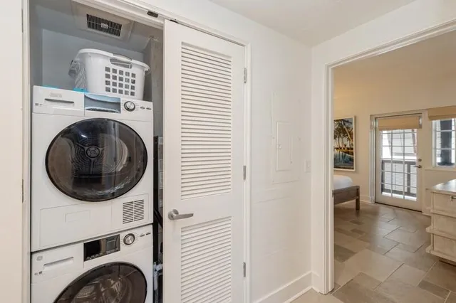 a view of a hallway with washer and dryer
