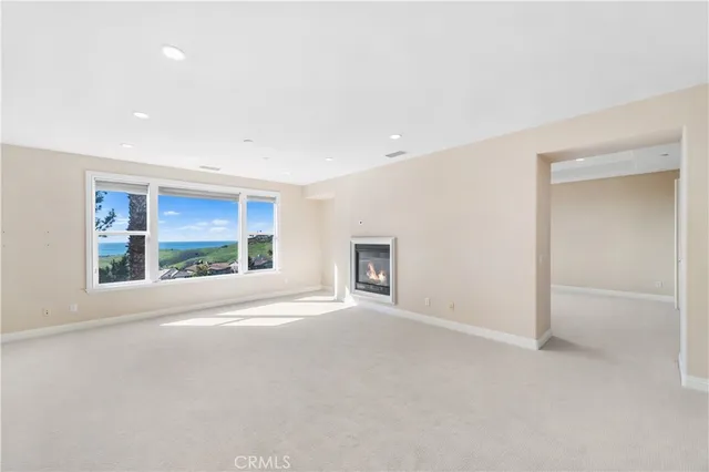 an empty room with a empty space and windows