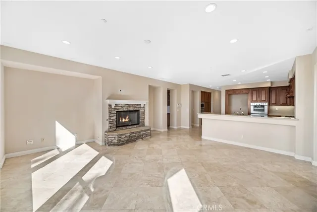 a view of living room with furniture and fireplace