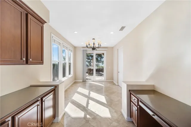 a view of an entryway with kitchen