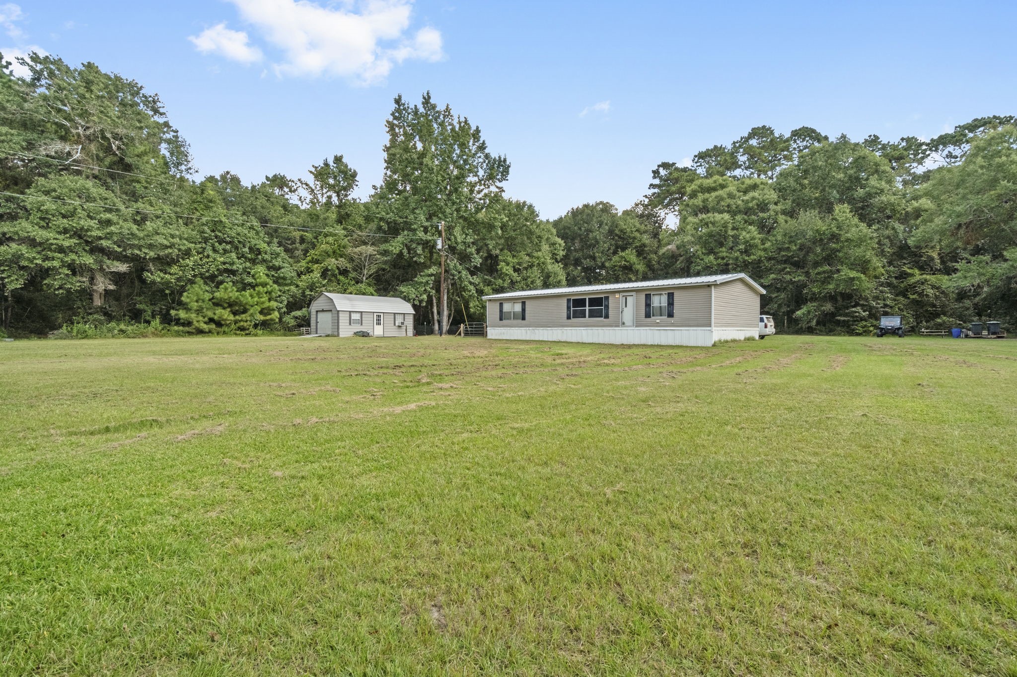 a view of a large pool with an outdoor space and seating area