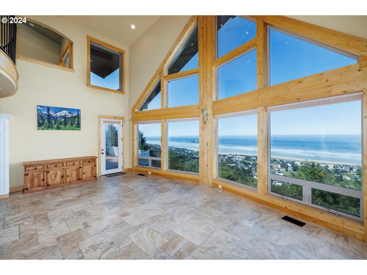 367 South Longview Loop Rockaway Beach, OR 97136 - Photo 11 of 43 a view of an empty room with a large window