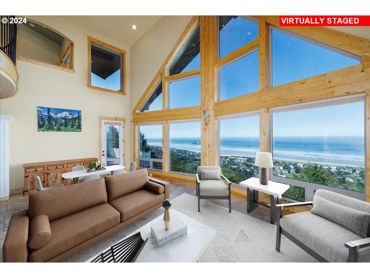 367 South Longview Loop Rockaway Beach, OR 97136 - Photo 12 of 43 a living room with furniture city view and large windows