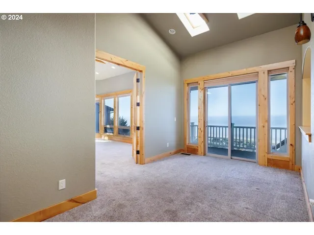 a view of empty room with front door
