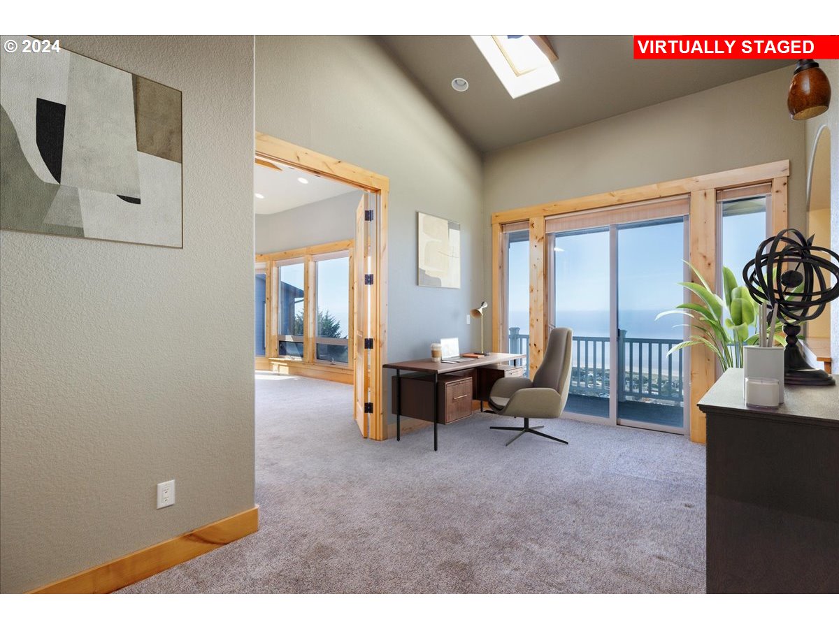 367 South Longview Loop Rockaway Beach, OR 97136 - Photo 18 of 43 a living room with furniture and a window