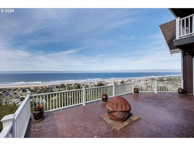 a view of a balcony with an ocean