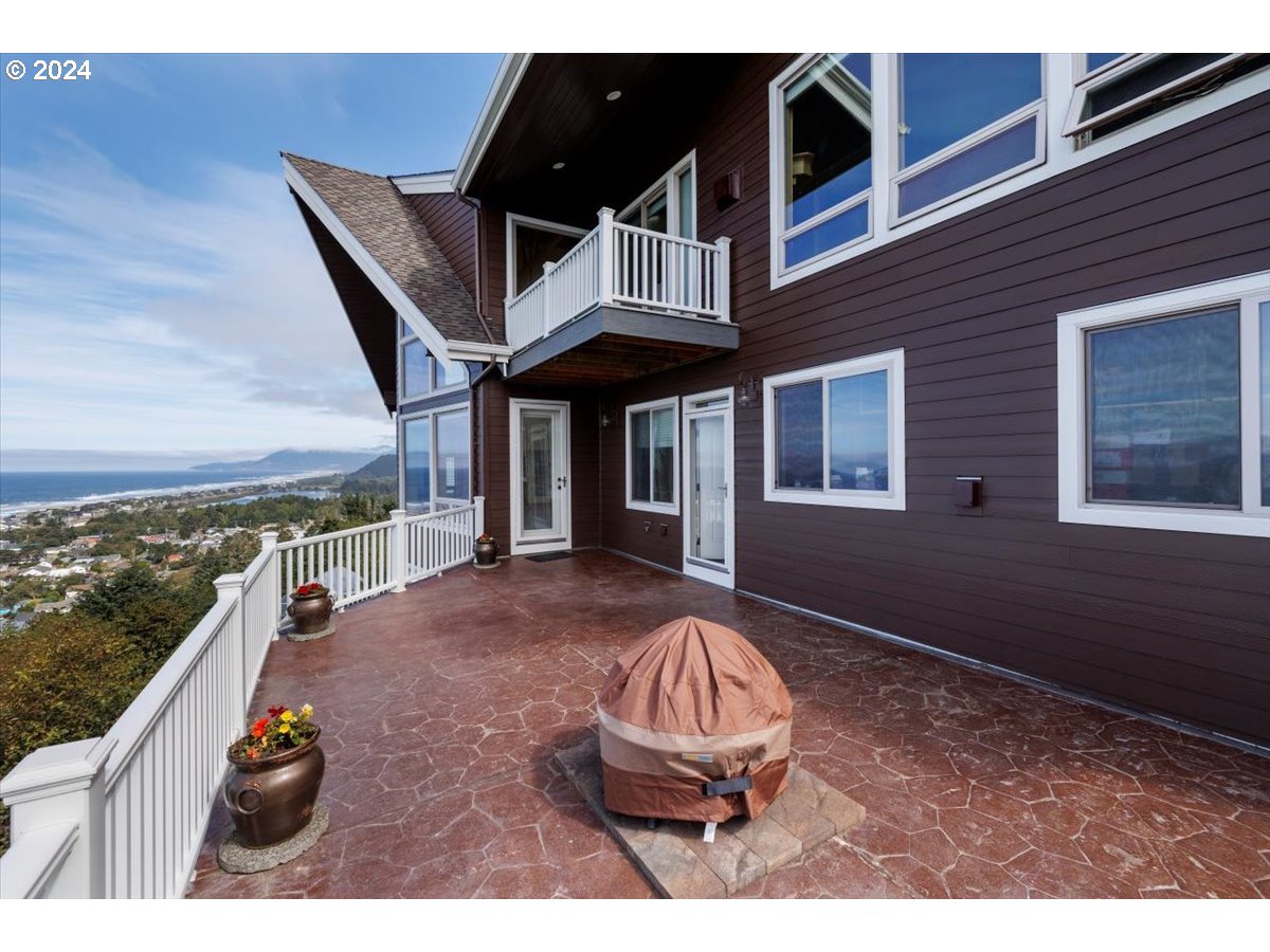 367 South Longview Loop Rockaway Beach, OR 97136 - Photo 30 of 43 a view of a house with backyard