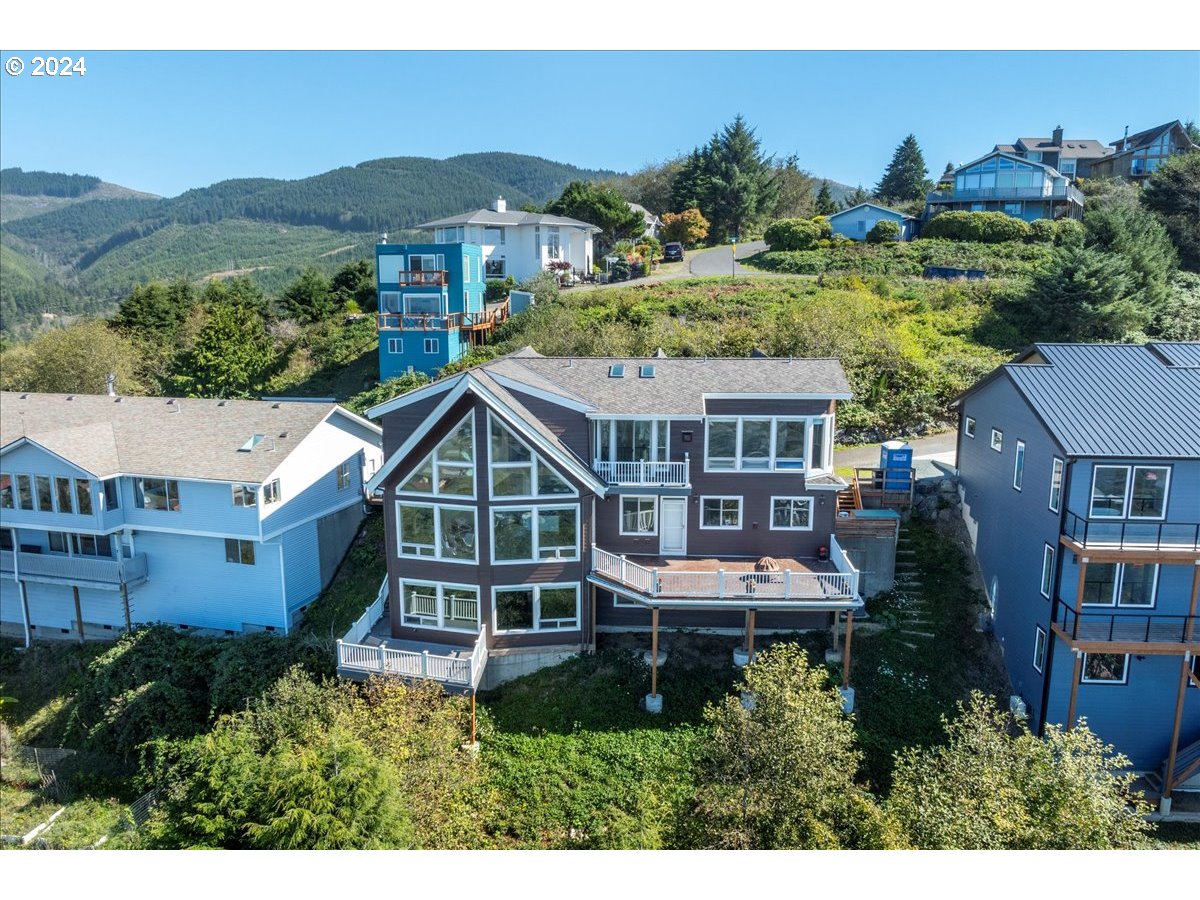 367 South Longview Loop Rockaway Beach, OR 97136 - Photo 3 of 43 a aerial view of a house with a garden view