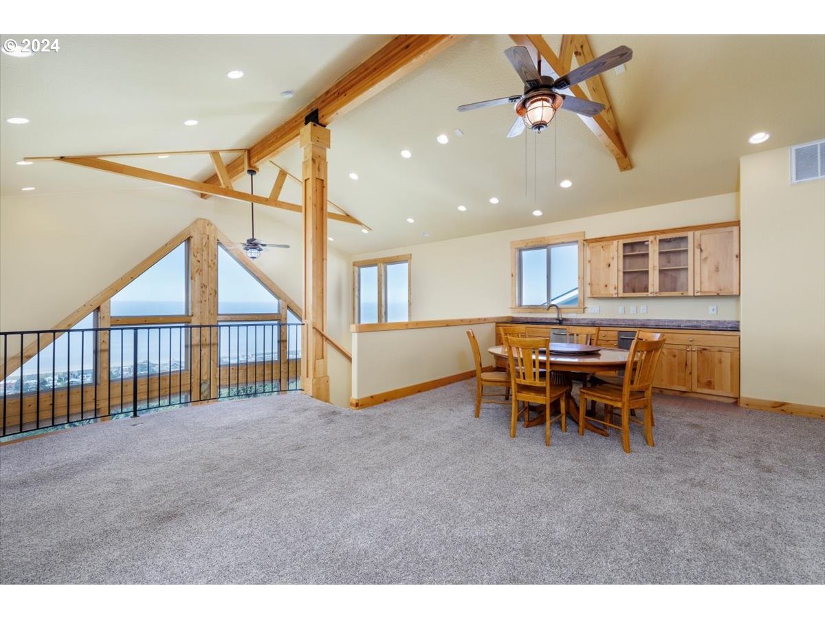 367 South Longview Loop Rockaway Beach, OR 97136 - Photo 37 of 43 a view of a livingroom with furniture and a window