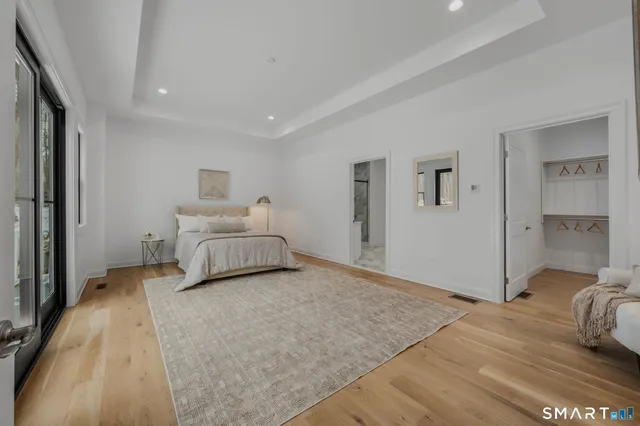 a bedroom with a bed and white walls