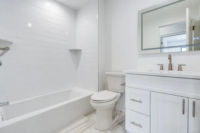 a bathroom with a sink a toilet and a bathtub