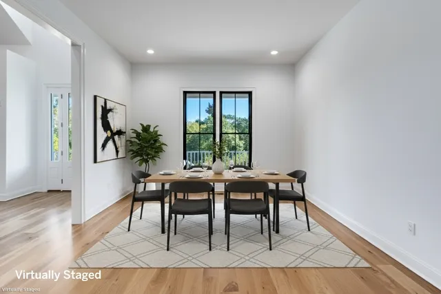 a dining room with furniture and window