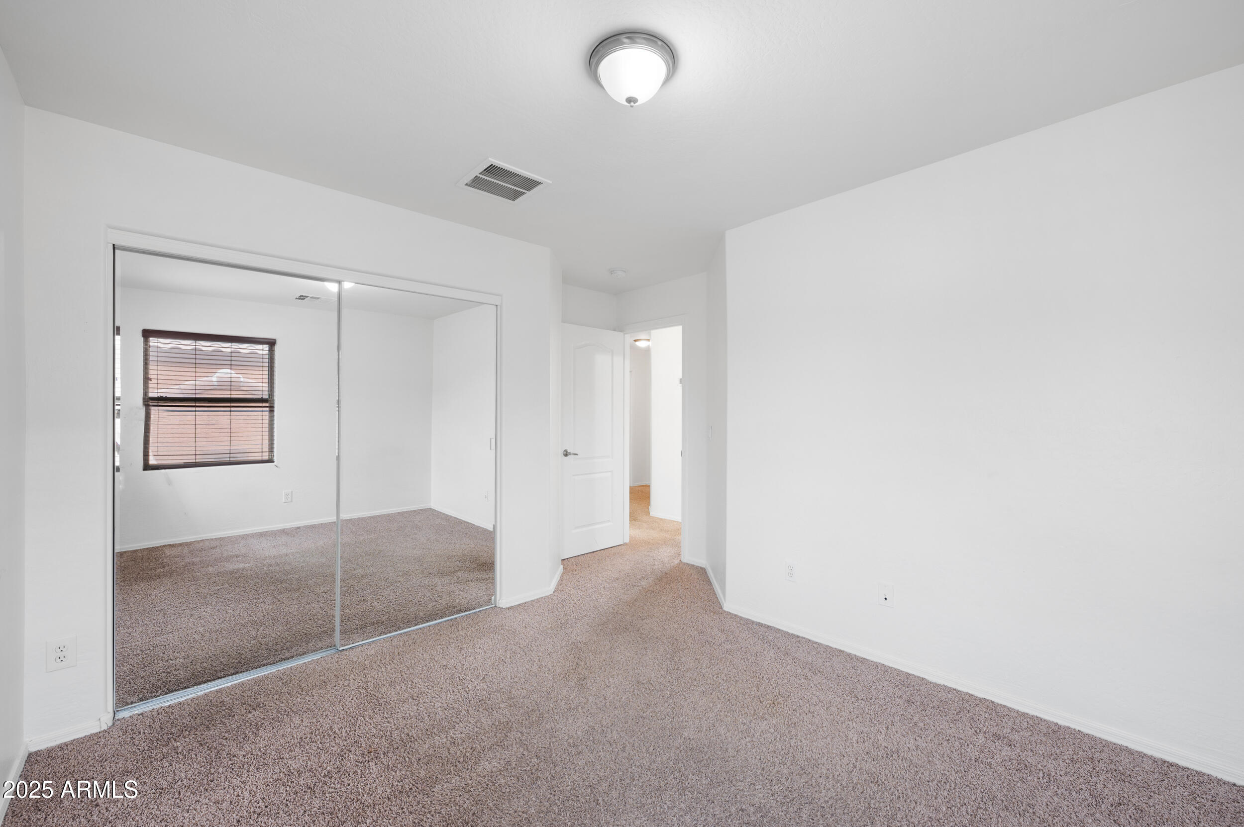 2646 East Megan Street Gilbert, AZ 85295 - Photo 24 of 40 an empty room with windows and closet
