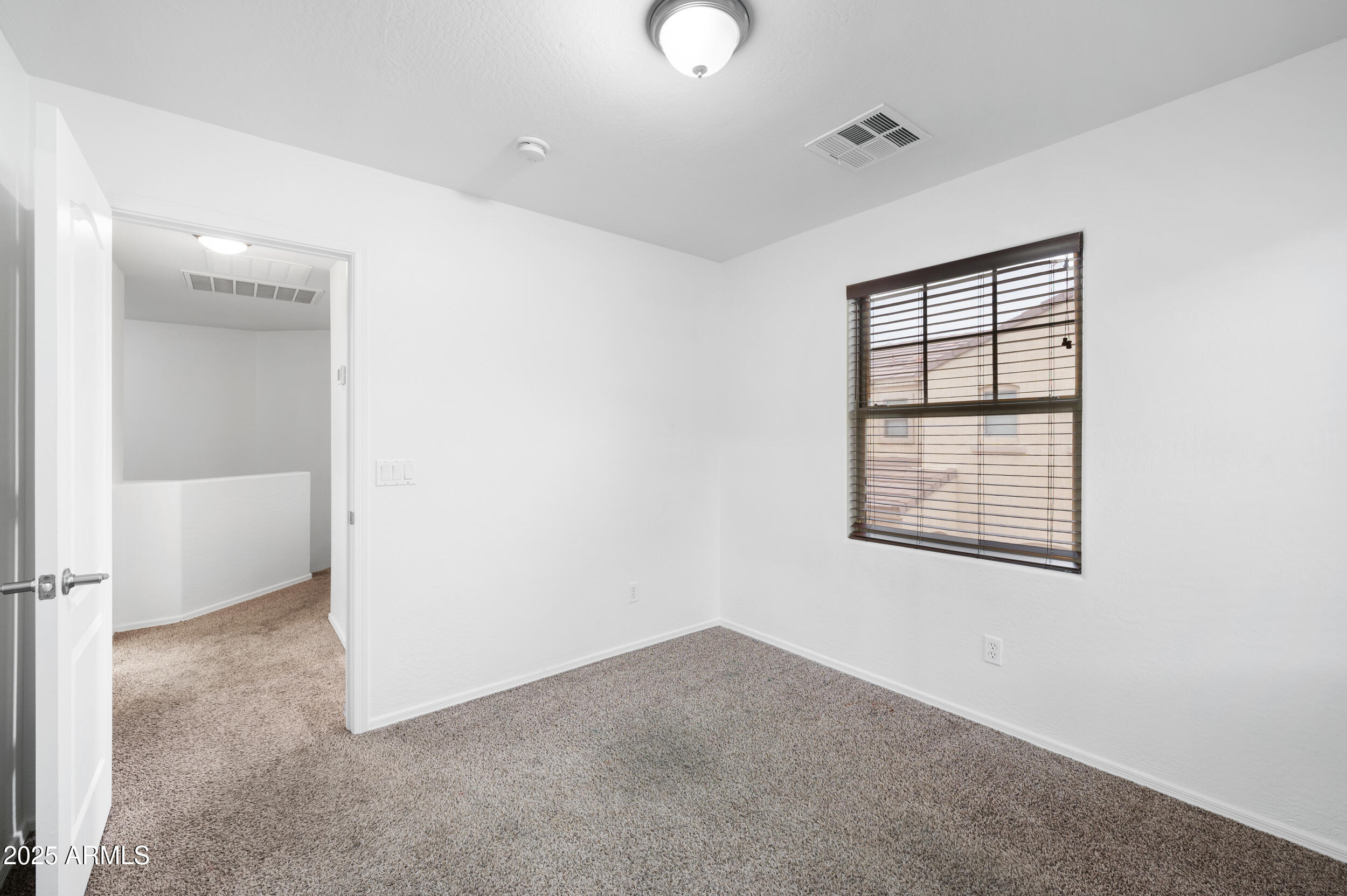 2646 East Megan Street Gilbert, AZ 85295 - Photo 25 of 40 a view of an empty room with a window
