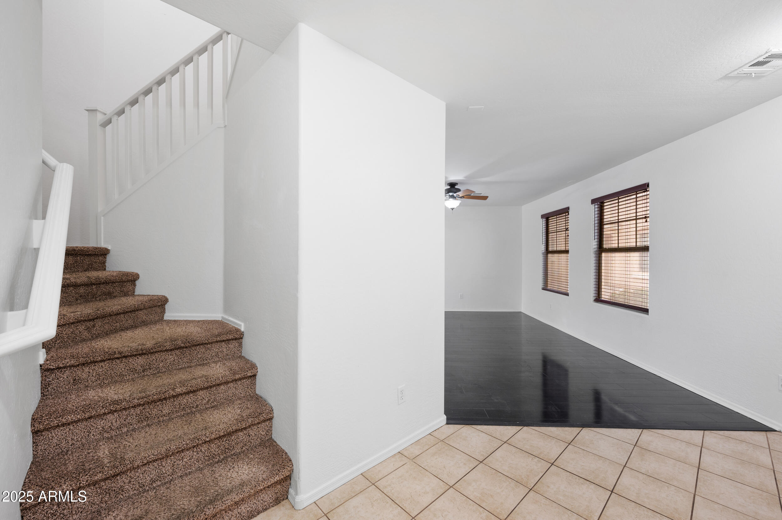 2646 East Megan Street Gilbert, AZ 85295 - Photo 5 of 40 a view of entryway and hall with wooden floor