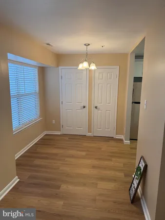 a view of an empty room with a fireplace