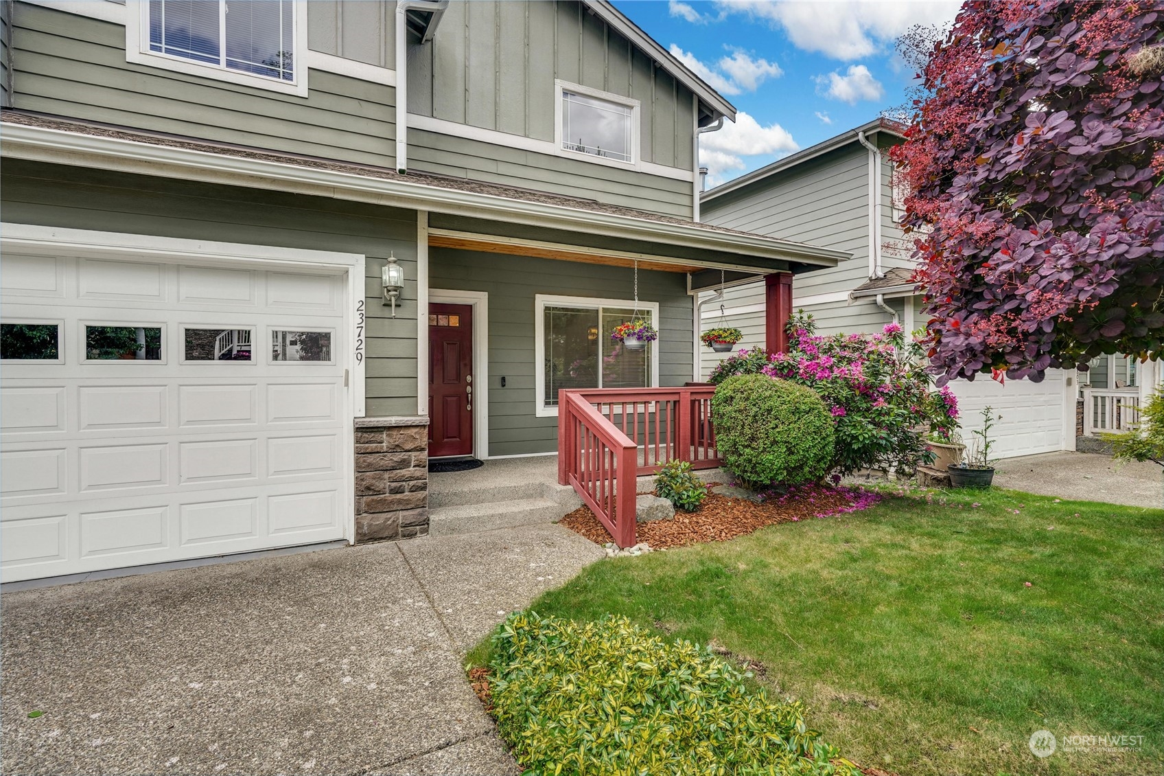 23729 17th Place West Bothell, WA 98021 - Photo 27 of 34 a front view of a house with a garden