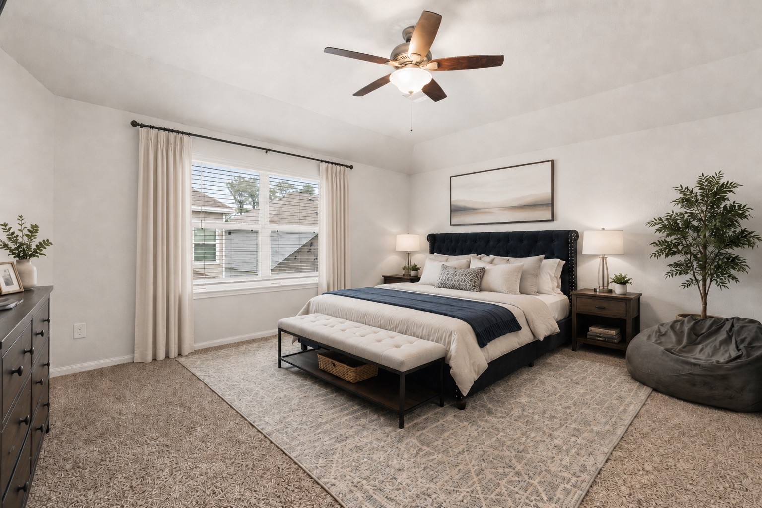 22210 Imperious Parkway Houston, TX 77073 - Photo 12 of 23 a spacious bedroom with a bed a chandelier and a window