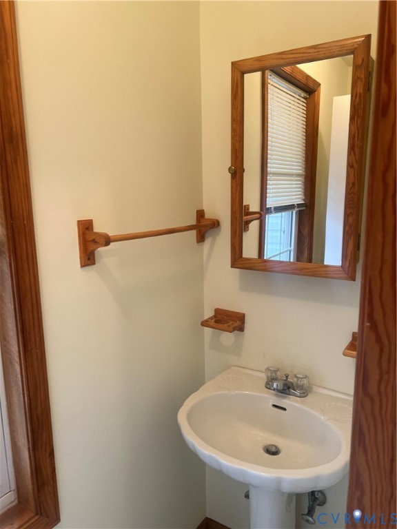 11449 Cedar Run Road Petersburg, VA 23805 - Photo 9 of 19 a bathroom with a sink and a mirror