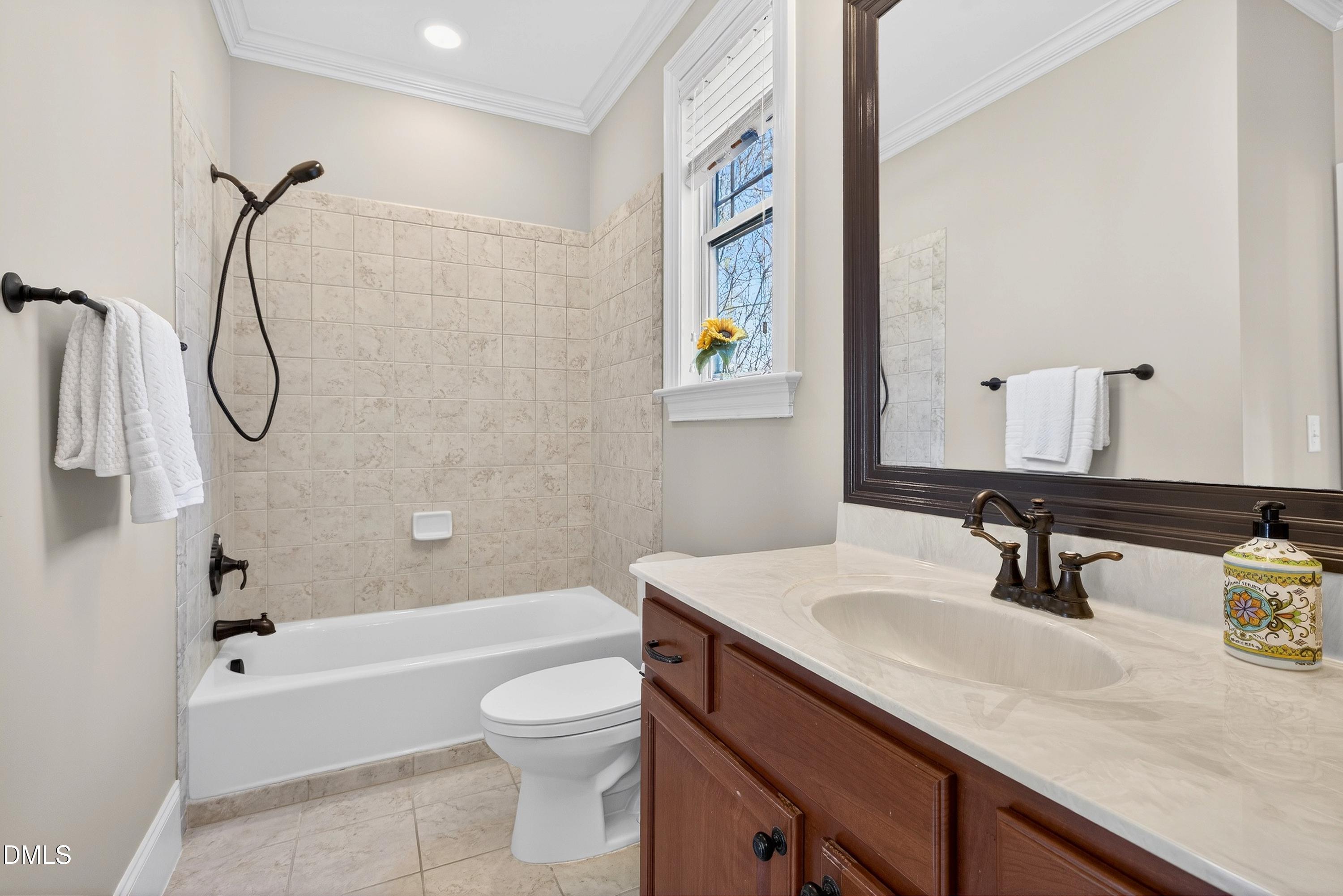 307 Ashdown Forest Lane Cary, NC 27519 - Photo 12 of 91 a bathroom with a granite countertop sink a toilet and shower