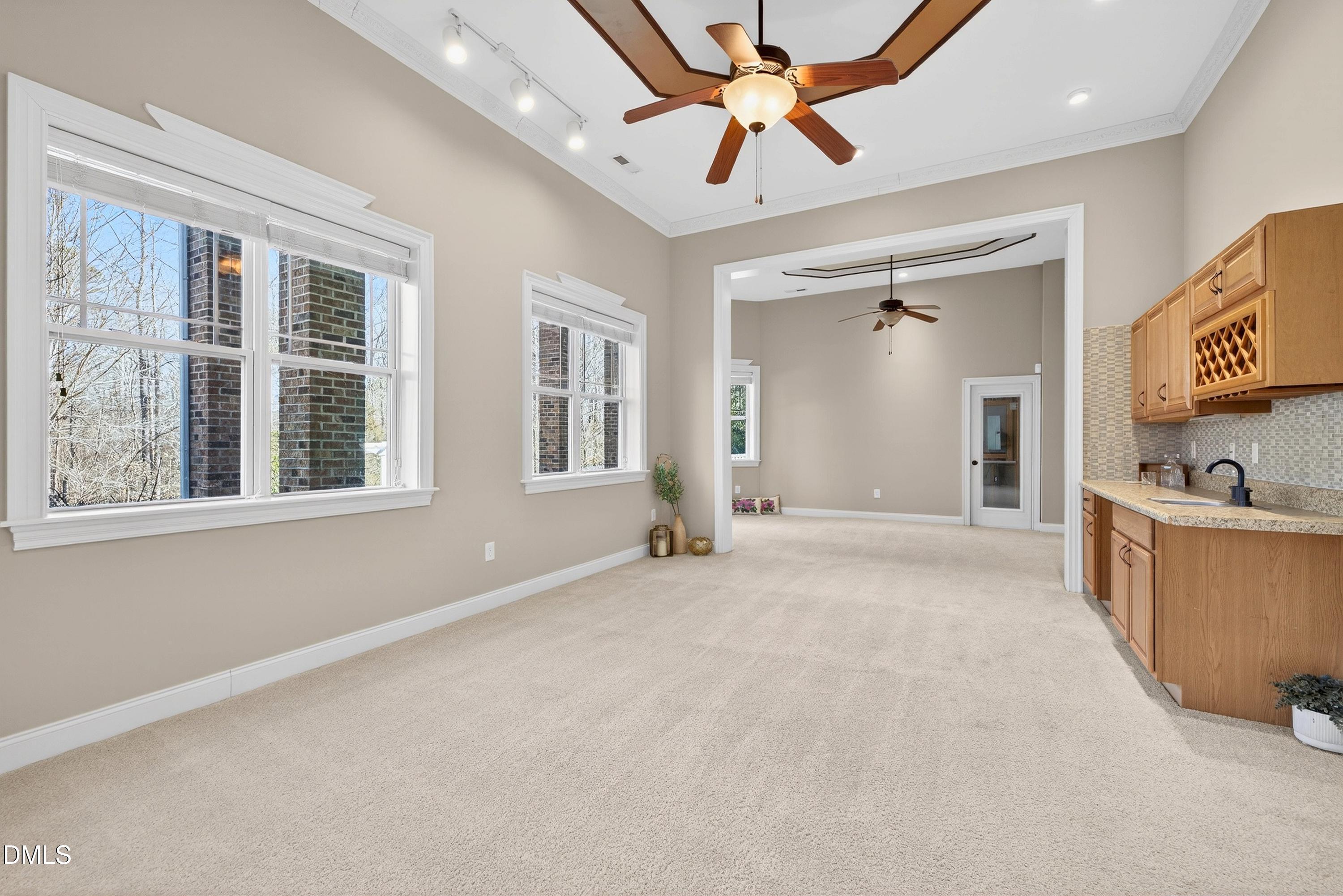 307 Ashdown Forest Lane Cary, NC 27519 - Photo 58 of 91 a view of an empty room with window and cabinet