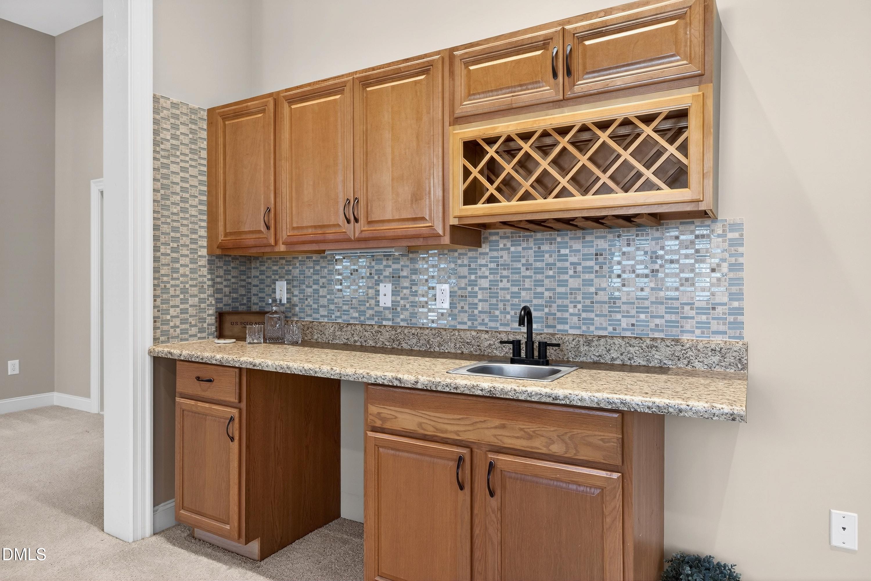 307 Ashdown Forest Lane Cary, NC 27519 - Photo 60 of 91 a kitchen with a sink and cabinets
