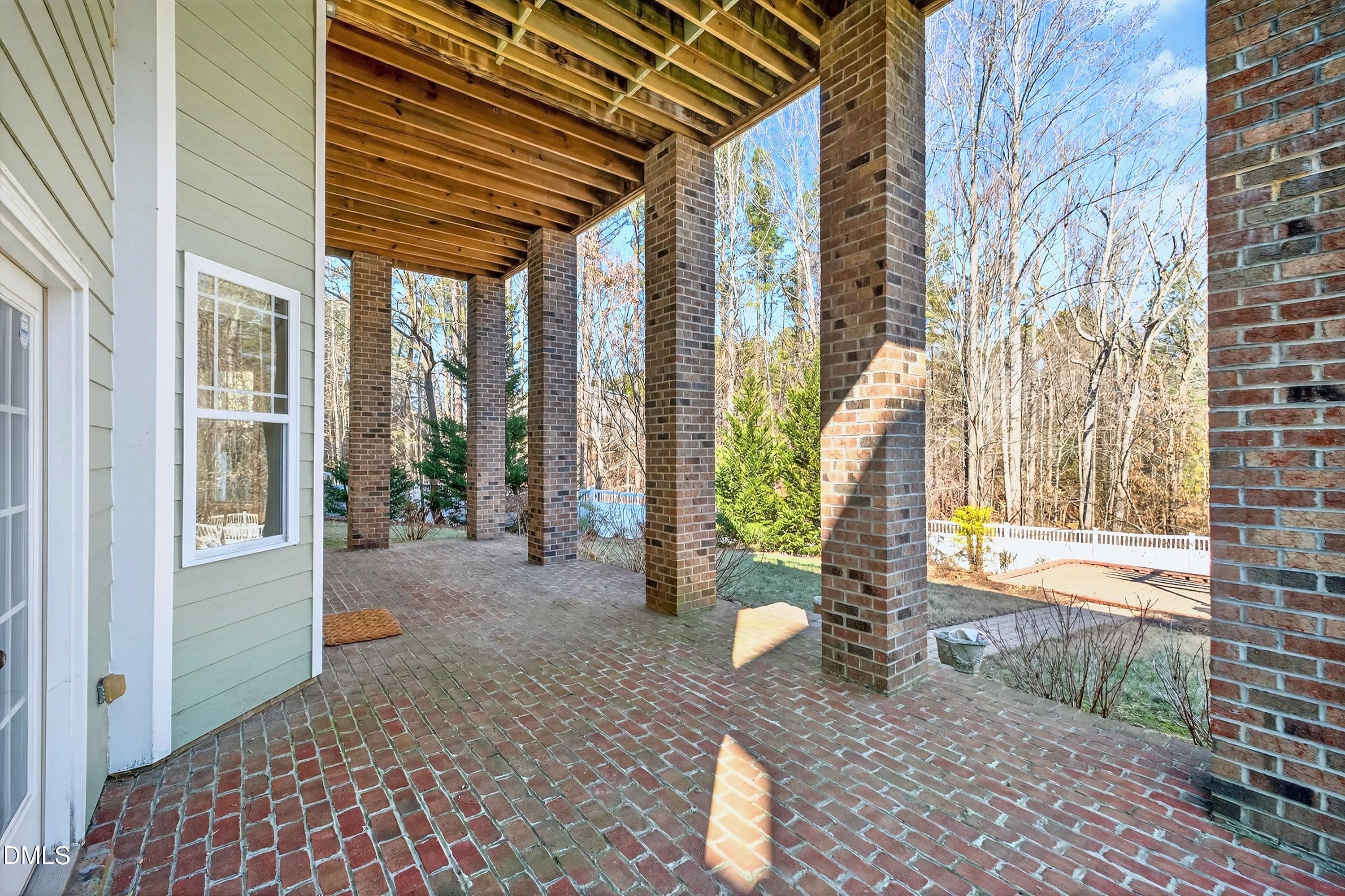 307 Ashdown Forest Lane Cary, NC 27519 - Photo 68 of 91 a view of a porch with a table and chairs