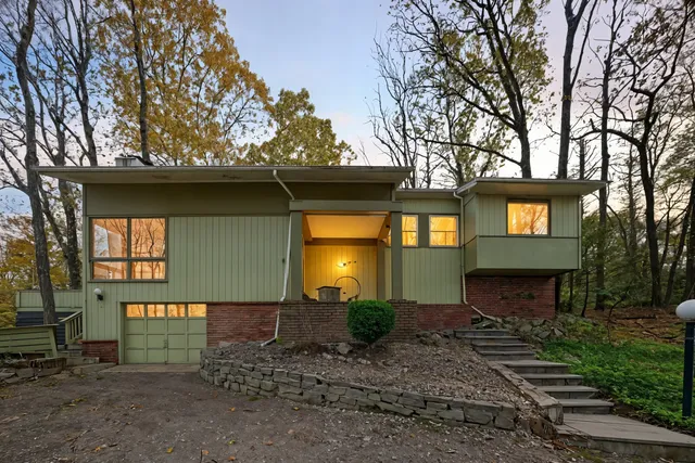 a view of a house with a small yard