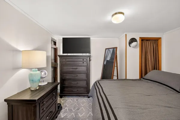 a view of a house with backyard and a tree