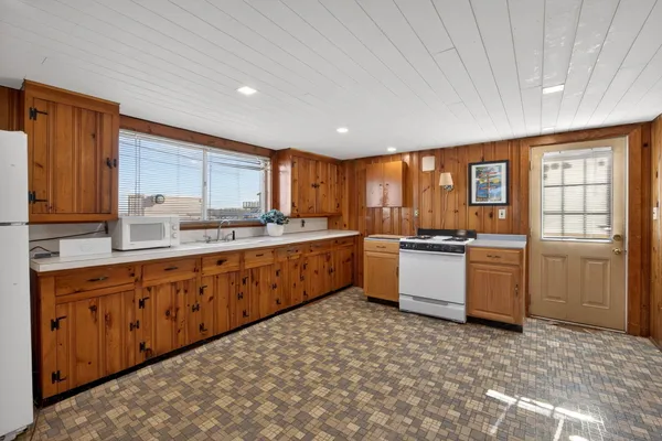 a bathroom with a sink toilet and mirror