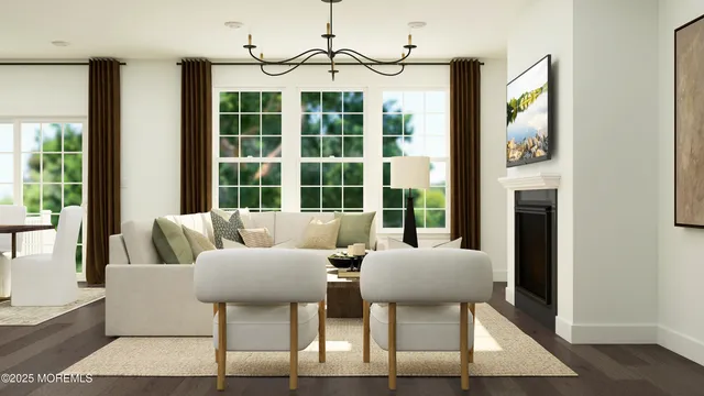 a living room with furniture and a floor to ceiling window