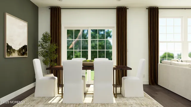 a dining room with furniture and a window
