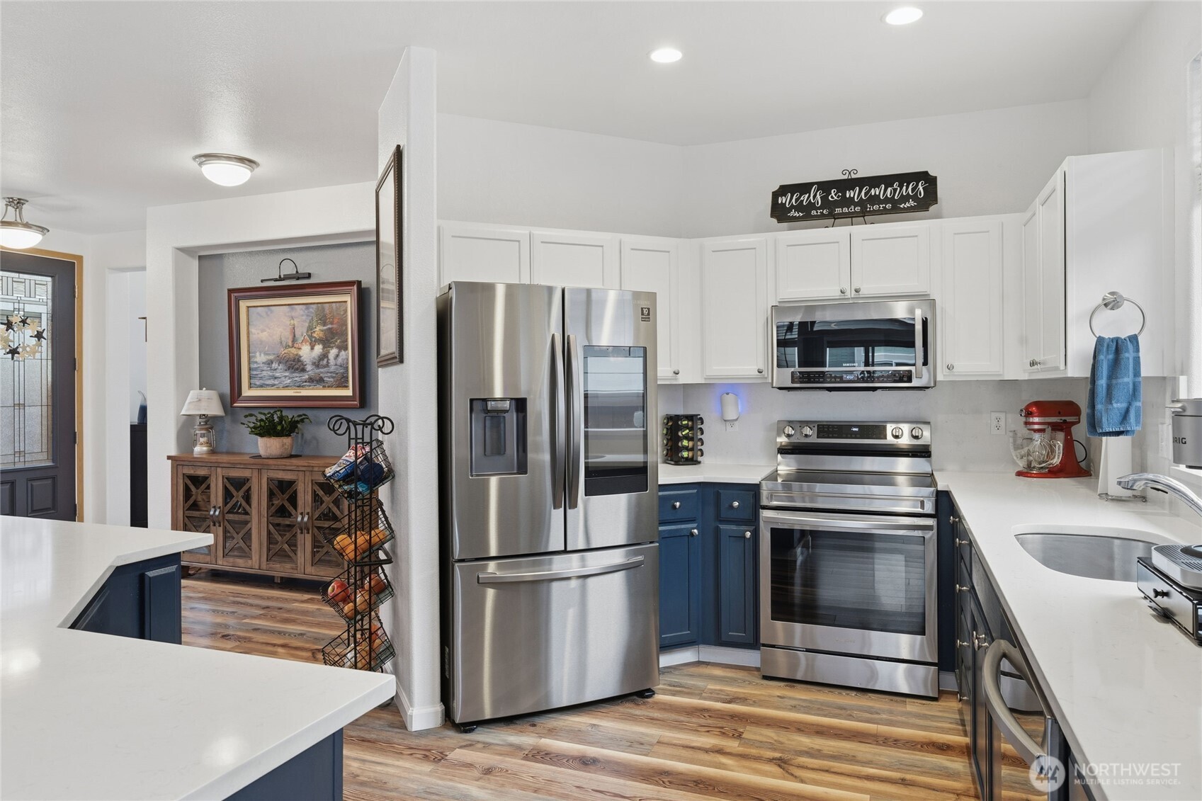 8218 Bainbridge Loop Northeast Lacey, WA 98516 - Photo 12 of 40 a kitchen with stainless steel appliances a refrigerator stove and microwave