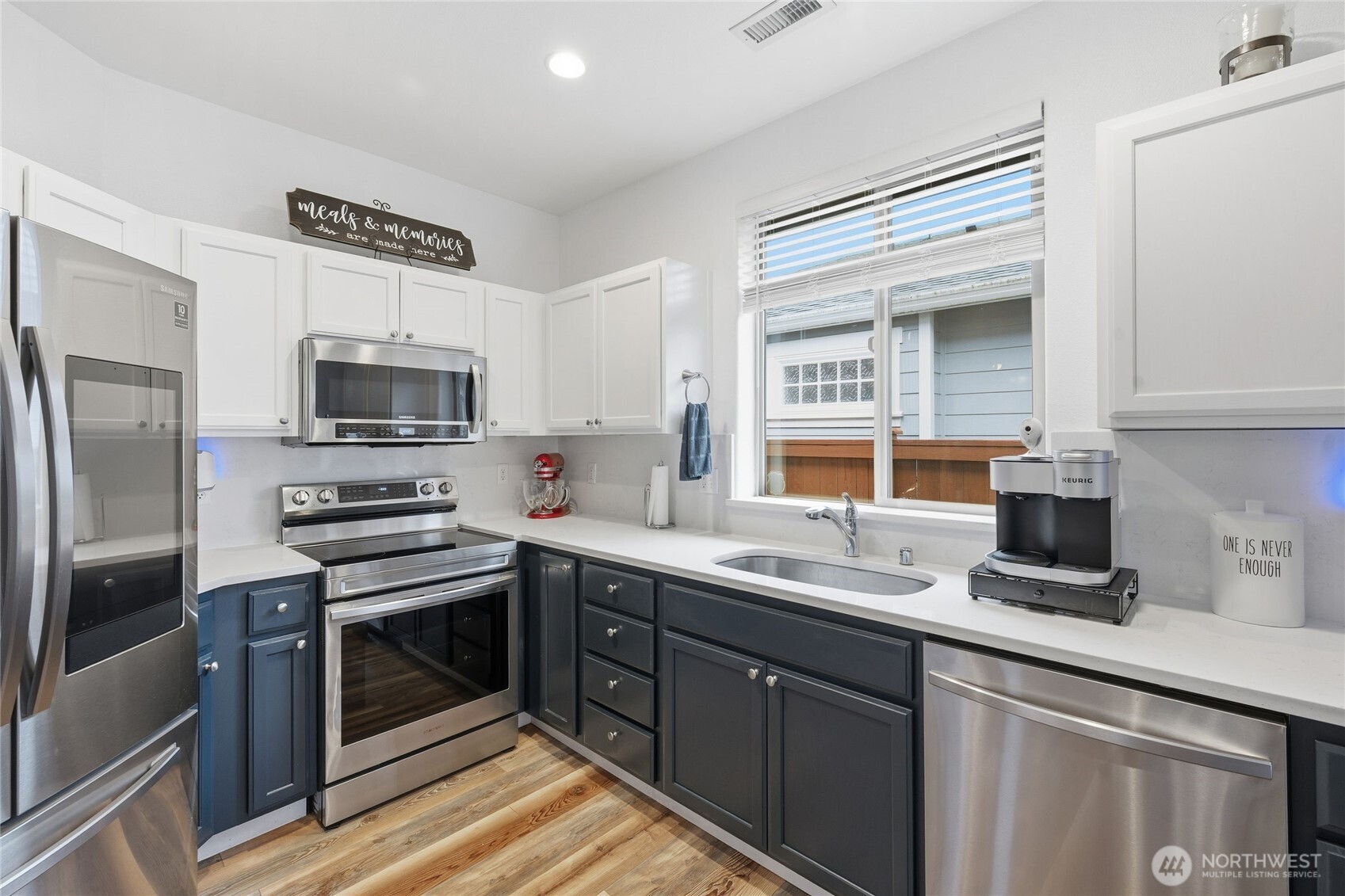 8218 Bainbridge Loop Northeast Lacey, WA 98516 - Photo 14 of 40 a kitchen with stainless steel appliances a stove sink and refrigerator