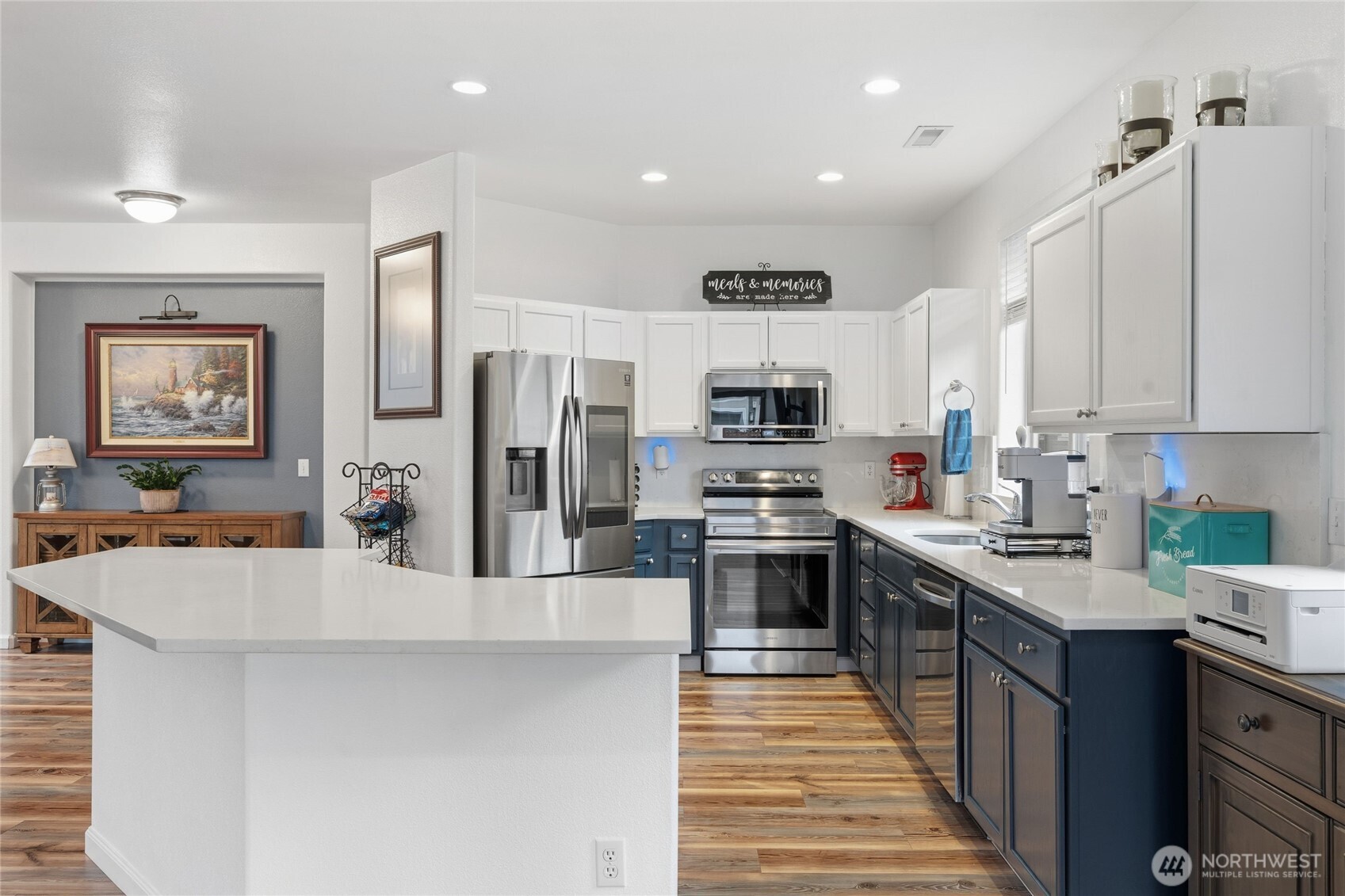 8218 Bainbridge Loop Northeast Lacey, WA 98516 - Photo 15 of 40 a kitchen with stainless steel appliances a stove refrigerator sink and microwave